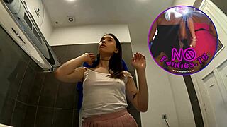 check out this braless hot brunette babe showing off legs and ass in a pink mini skirt