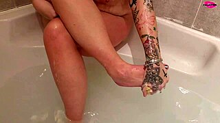 this milf is teasing while washing her feet so seductively. her smooth skin is pure temptation!